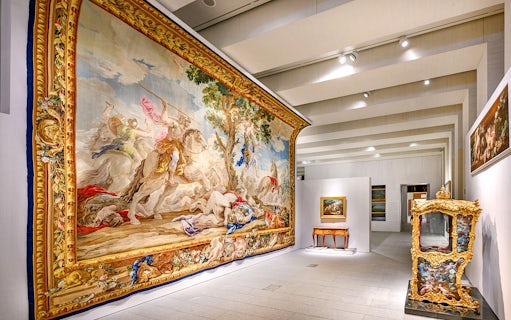 Royal Collections Gallery tapestry and ornate cabinet display.