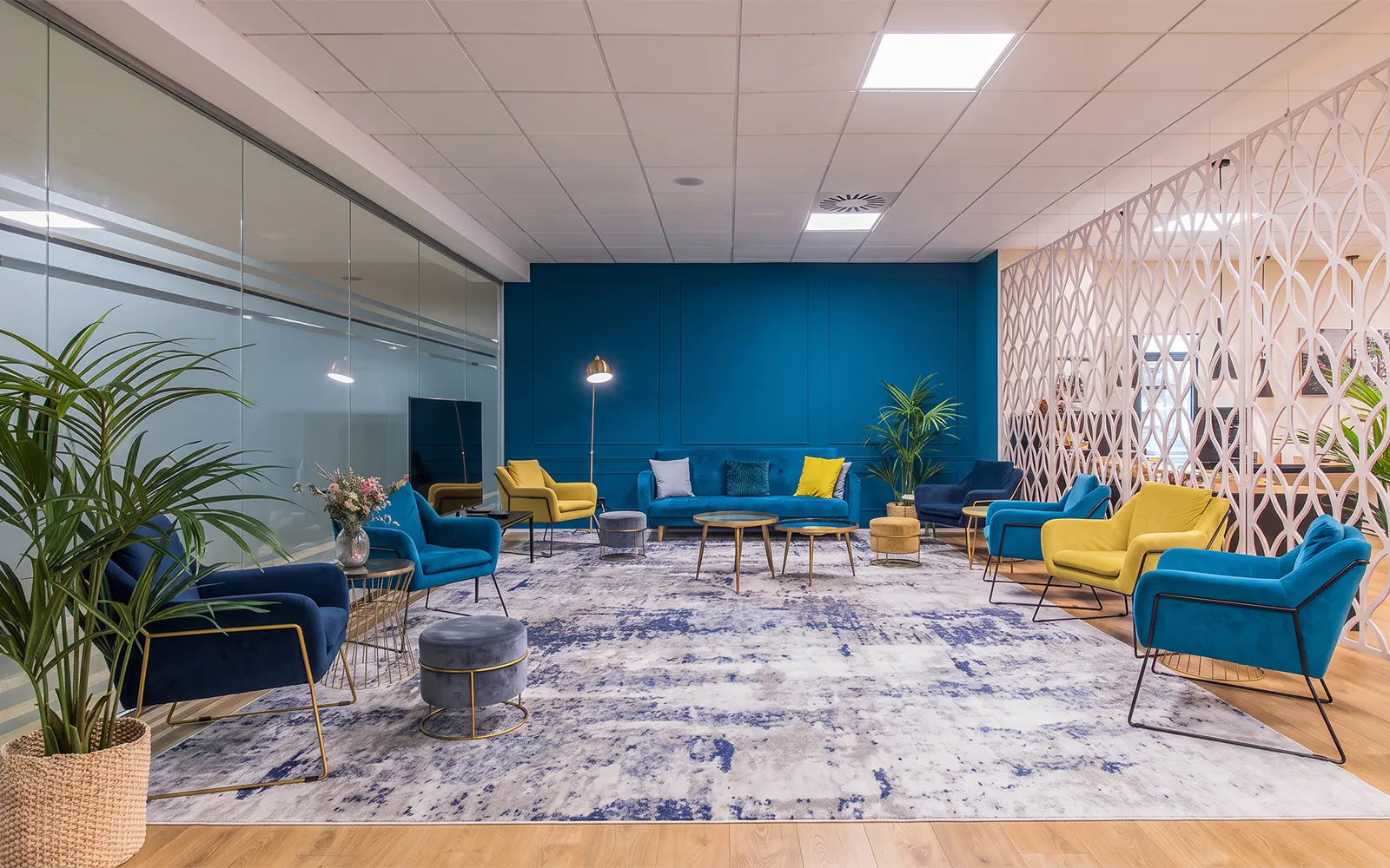 Sleep & Fly Business Center lounge with colorful seating at Barcelona El Prat Airport T1.