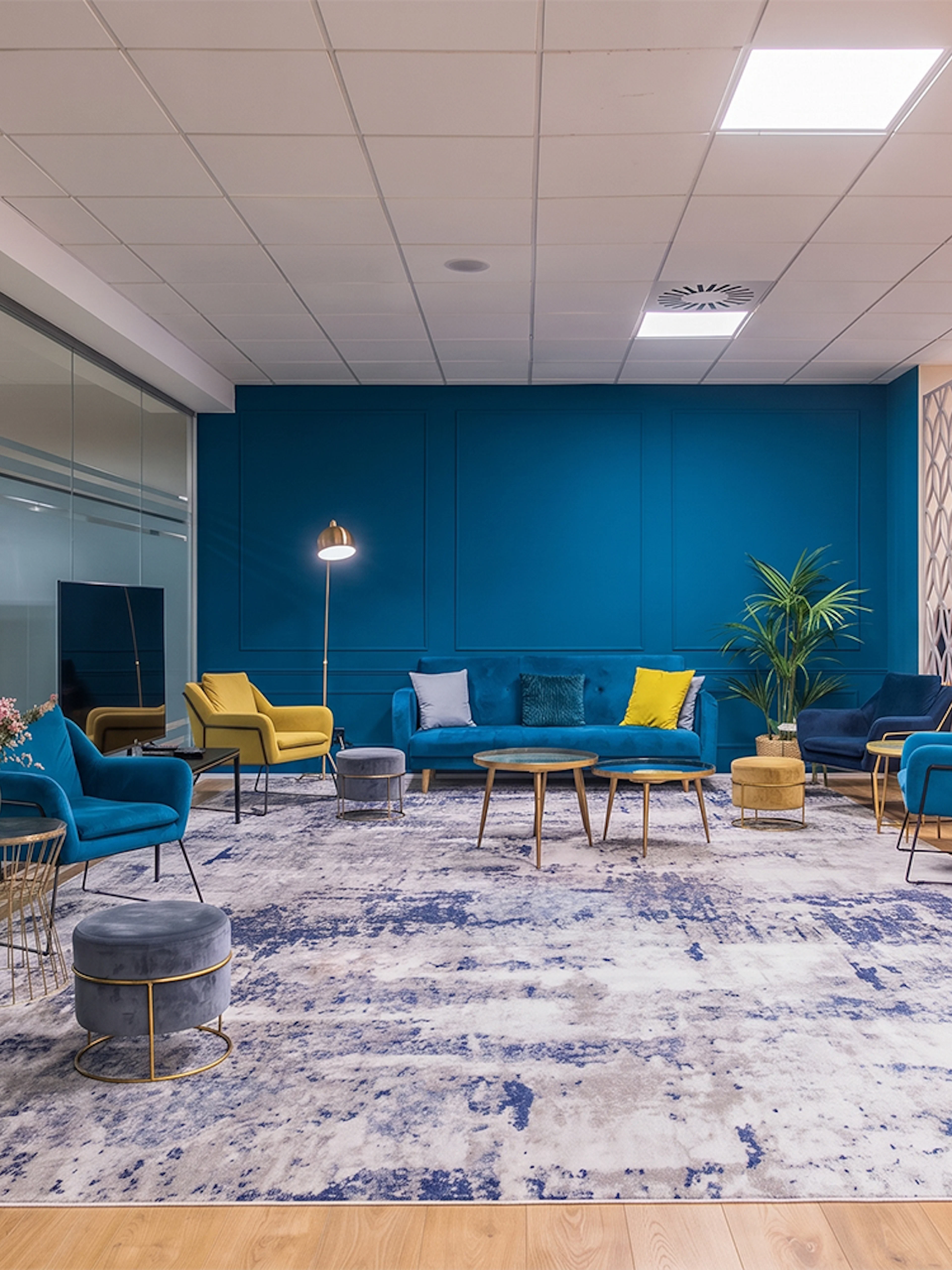 Sleep & Fly Business Center lounge with colorful seating at Barcelona El Prat Airport T1.