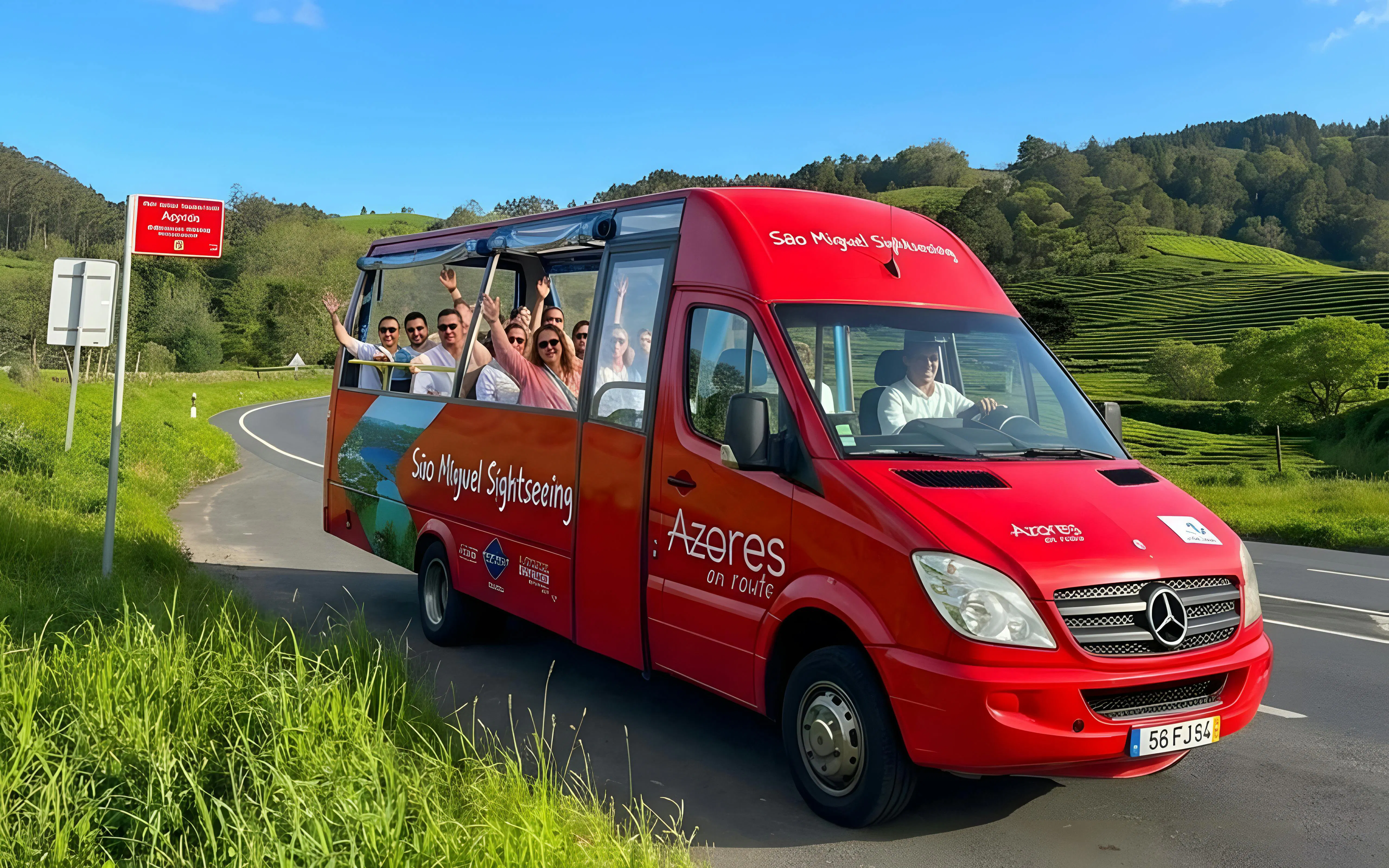 Hop-on hop-off bus with tourists on São Miguel road, Azores.