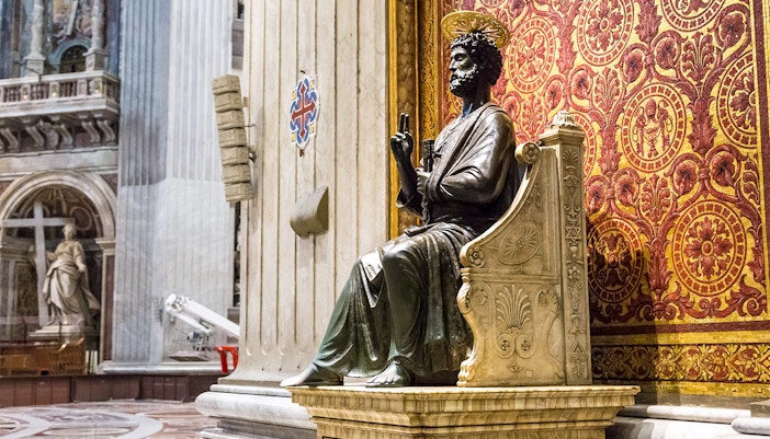 Vatican Grottoes interior with ancient tombs and religious artifacts.
