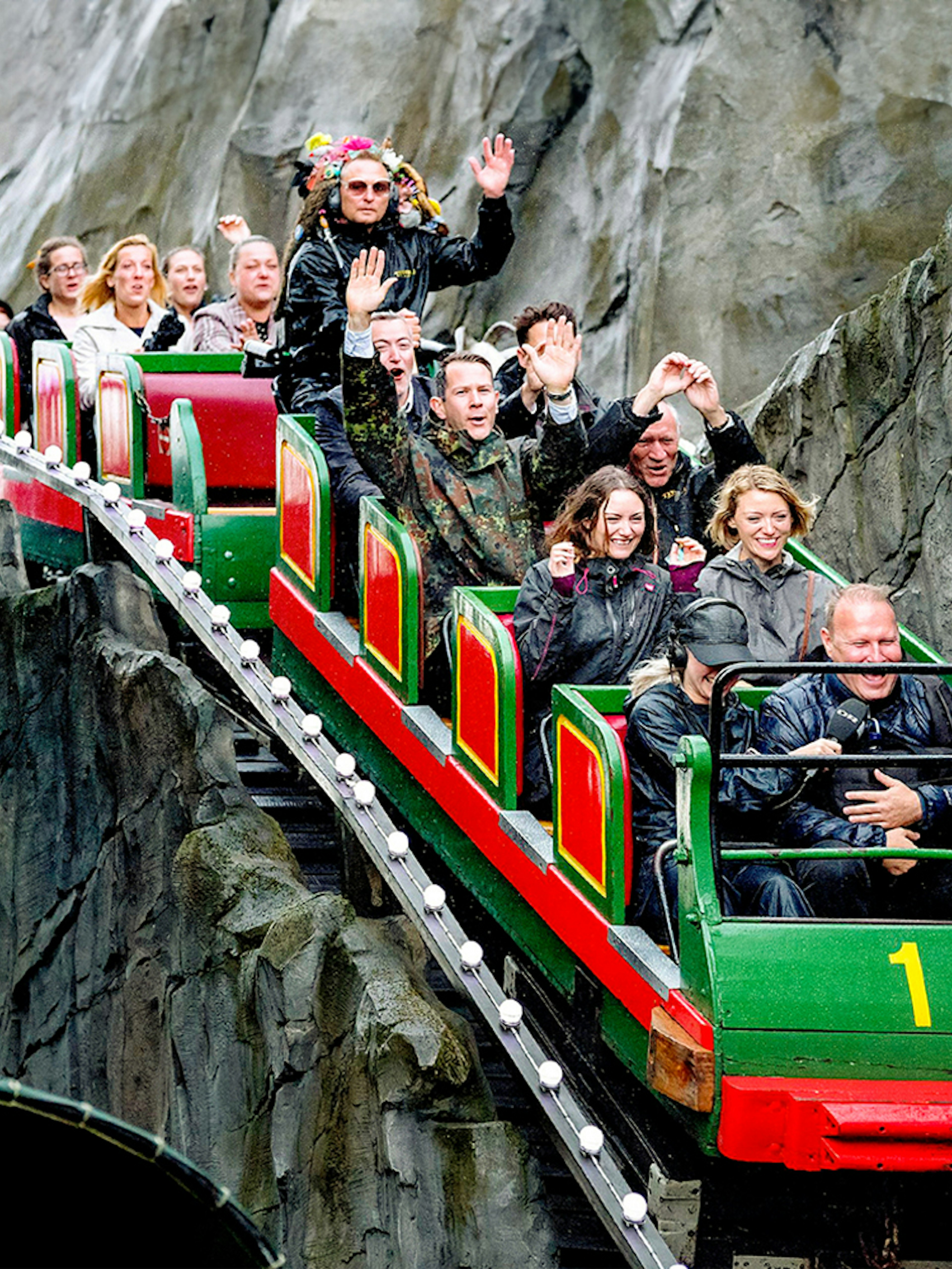 Visitors enjoying a roller coaster ride at Tivoli Gardens, Copenhagen.