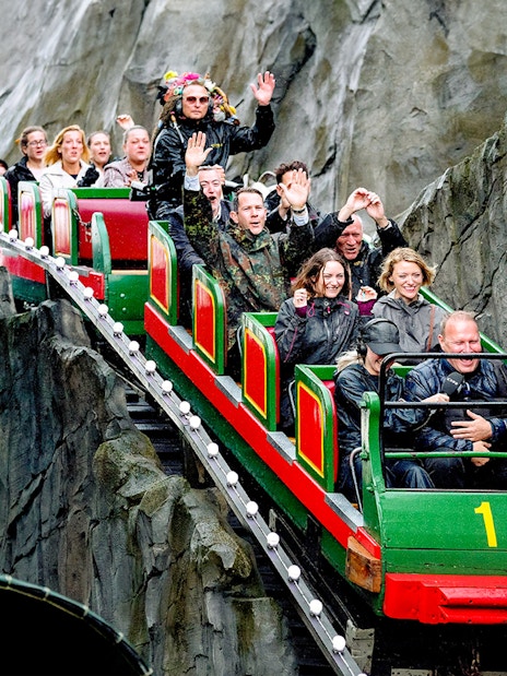Visitors enjoying a roller coaster ride at Tivoli Gardens, Copenhagen.