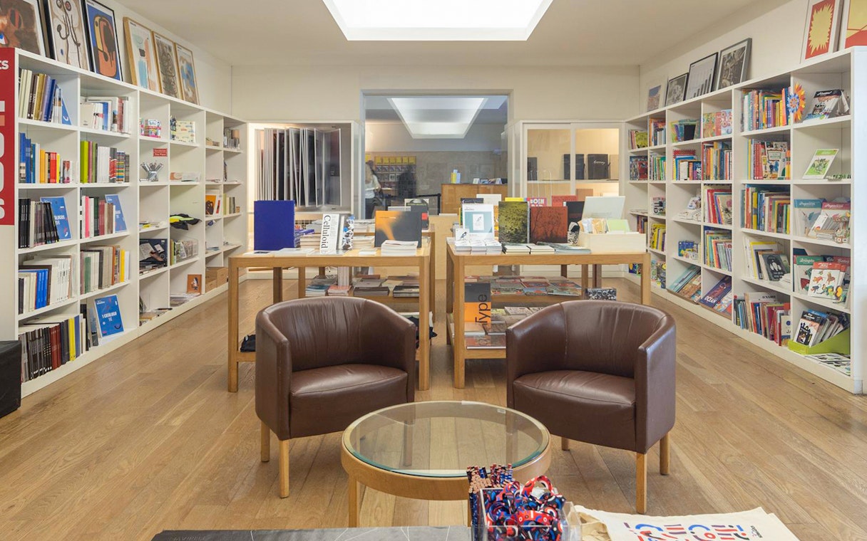 Serralves Foundation bookstore with shelves of books and seating area.