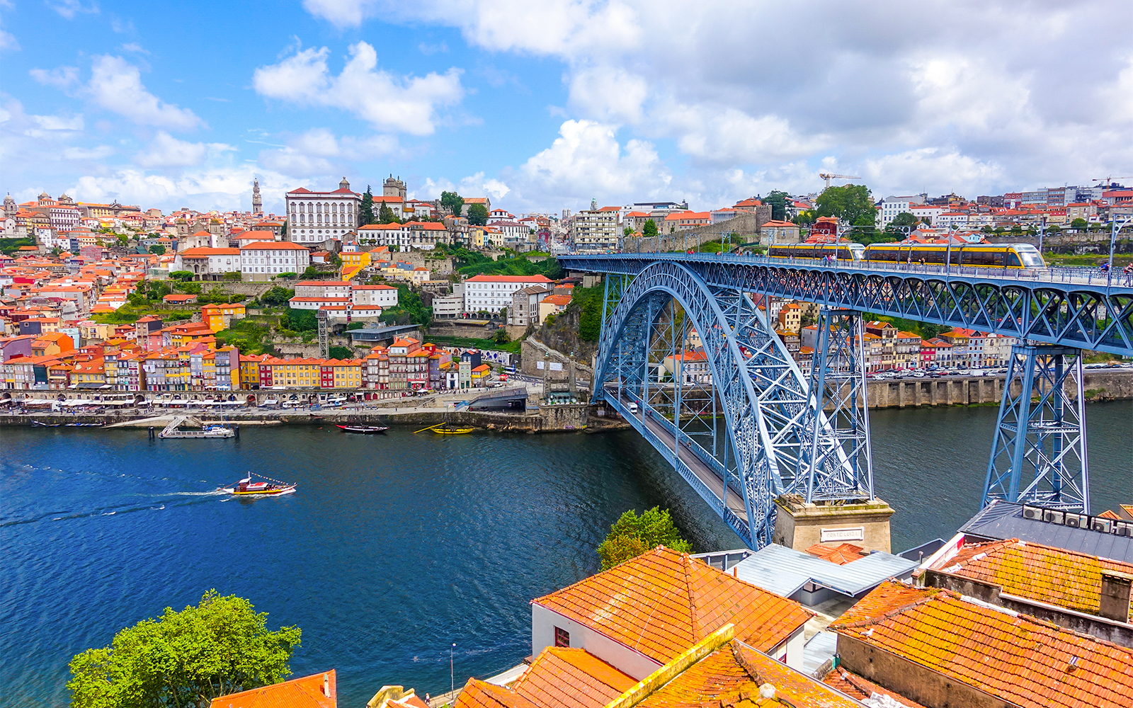 Porto cityscape with Dom Luís I Bridge over Douro River, Portugal.