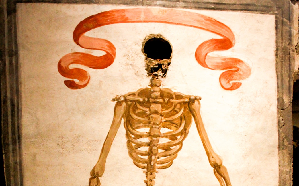 Skeleton mural in Catacombs of San Gaudioso, Naples, Italy.