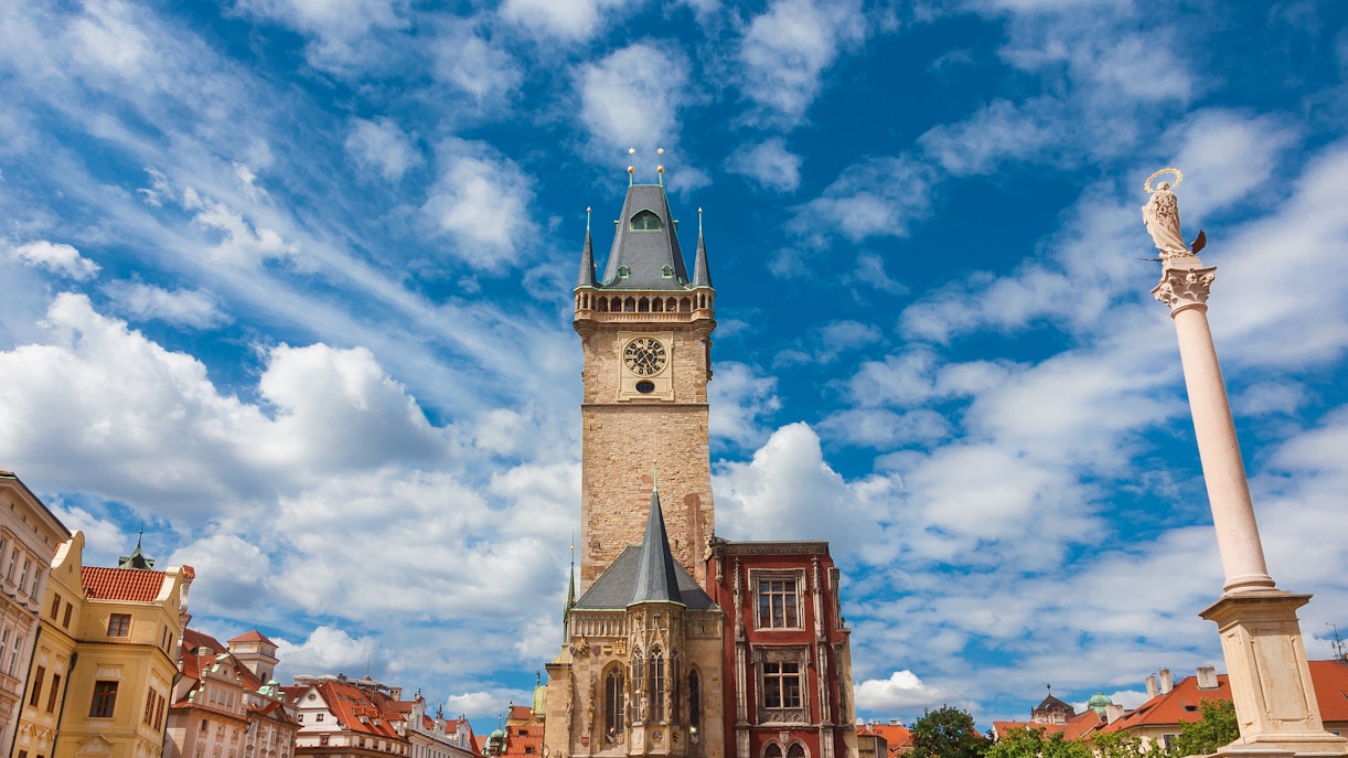 Old Town Hall medieval clock tower in Prague under a blue sky.