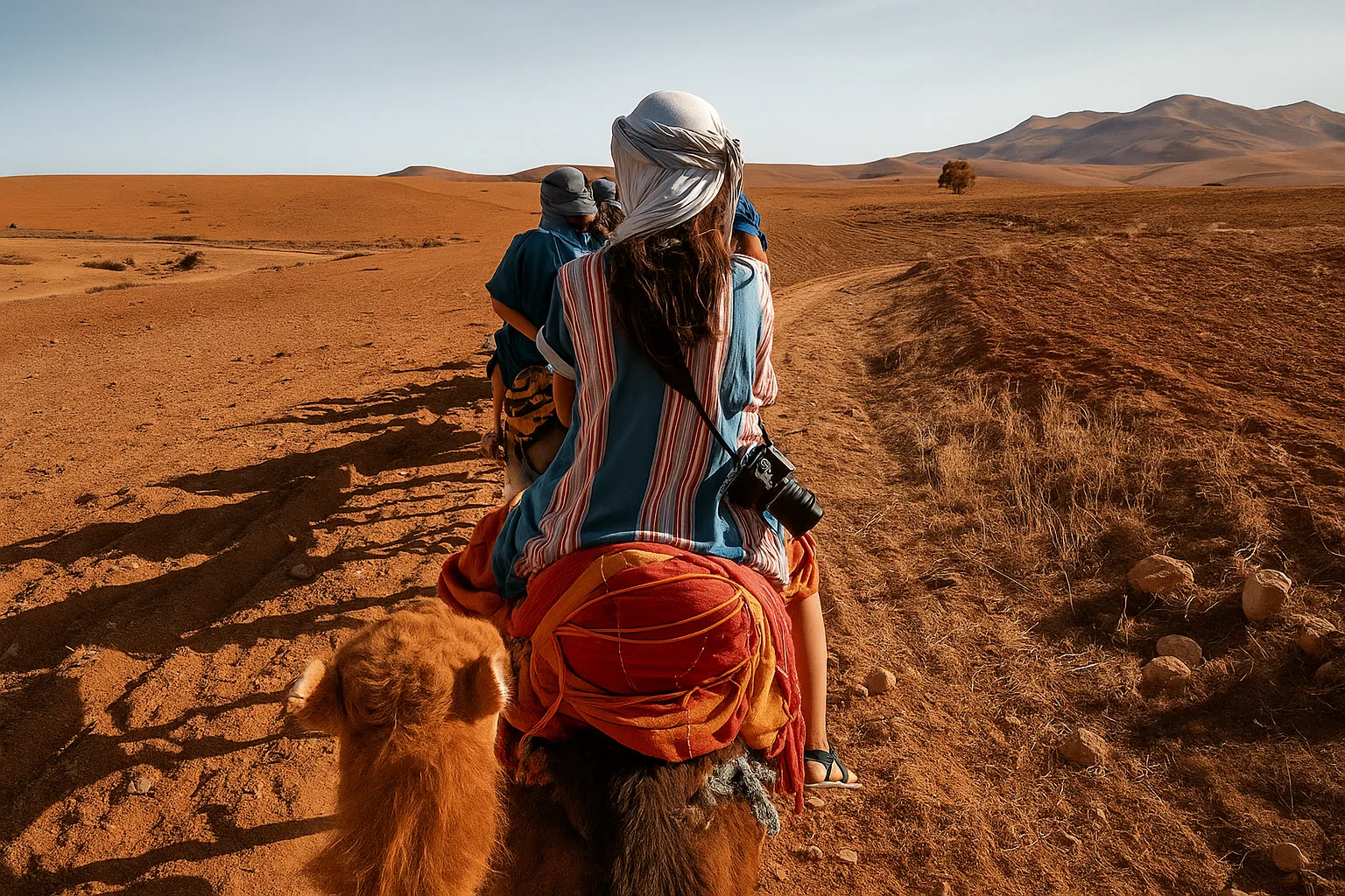 People riding camels in Agafay Desert, Marrakech.