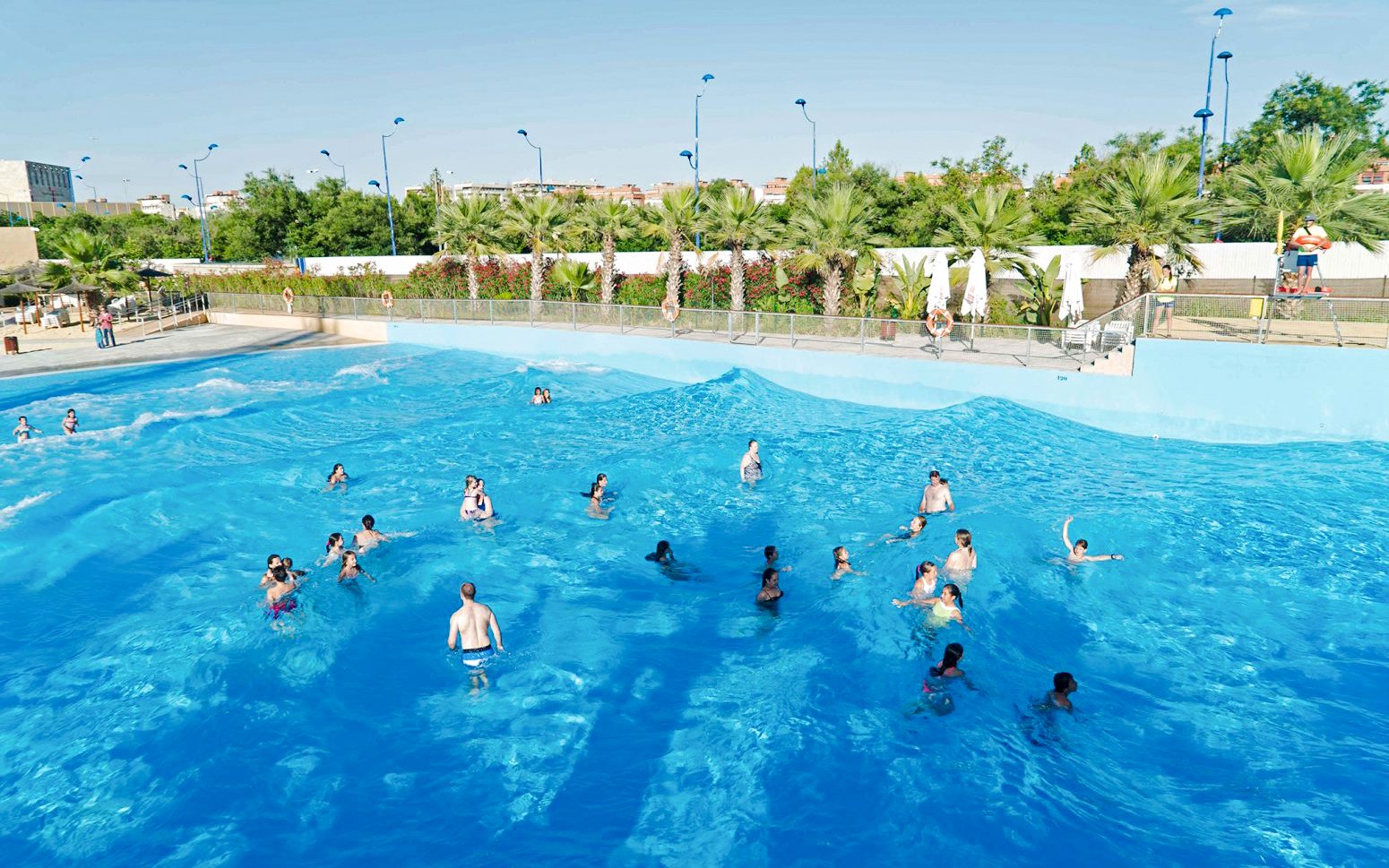 Visitors enjoying the wave pool at The Reef Pool, Aqua Magica.