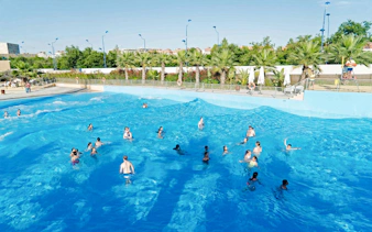 Visitors enjoying the wave pool at The Reef Pool, Aqua Magica.