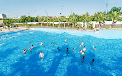 Visitors enjoying the wave pool at The Reef Pool, Aqua Magica.