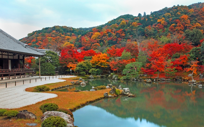 Water body beside Tenryuji Temple with autumn foliage in Kyoto, Japan.