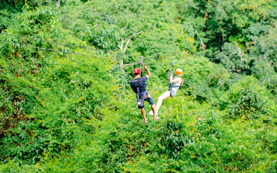 Ziplining through lush forest canopy near Koh Samui.