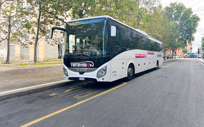 Terravision bus parked on a street, offering round-trip service between Ciampino Airport and Rome city center.