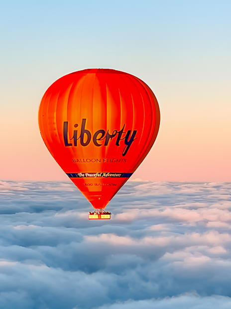 Hot air balloon over clouds at sunrise, Geelong/Bellarine.