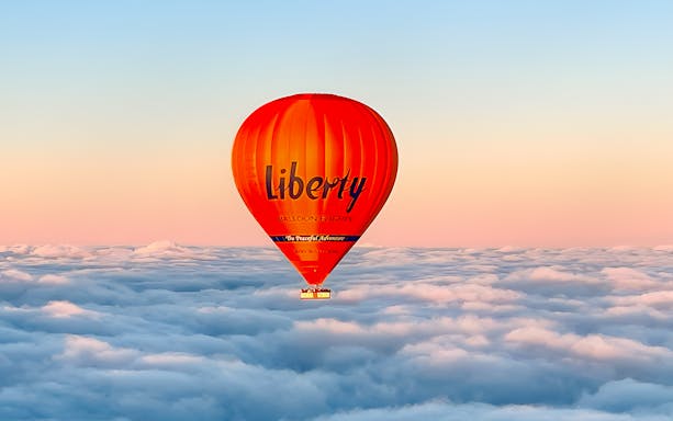 Hot air balloon over clouds at sunrise, Geelong/Bellarine.