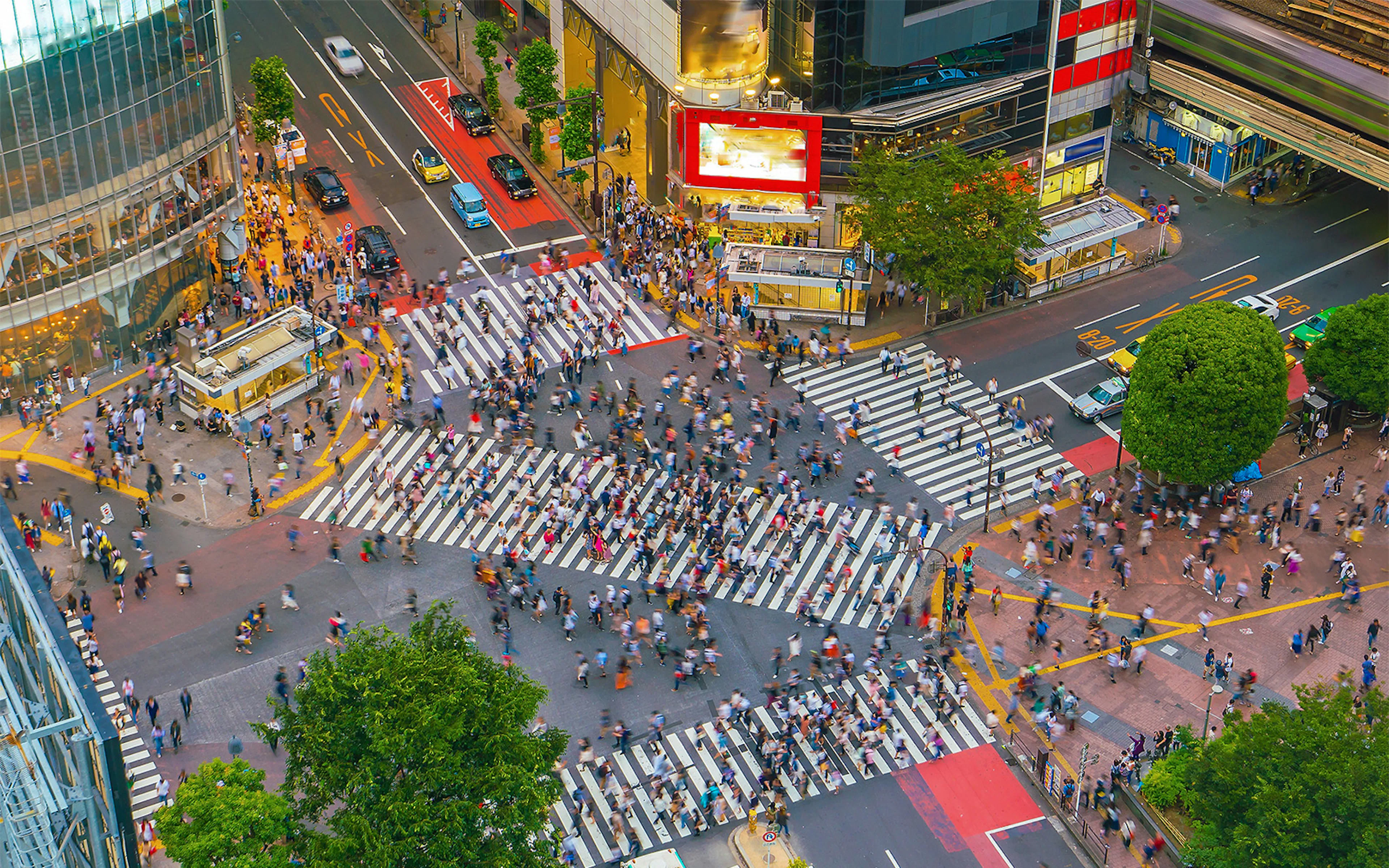 Crowds crossing Shibuya Scramble Square intersection in Tokyo, Japan.
