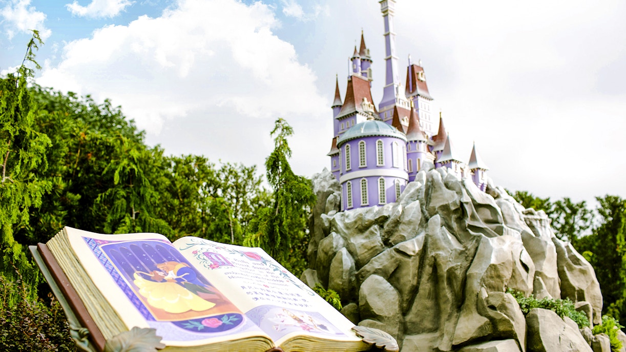 Open storybook and castle at Mystic Point, Disneyland Hong Kong.