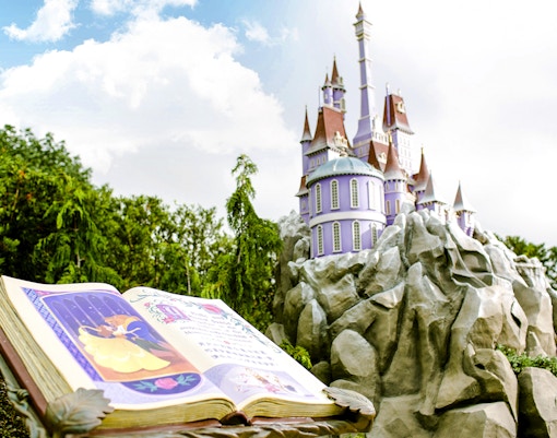 Open storybook and castle at Mystic Point, Disneyland Hong Kong.