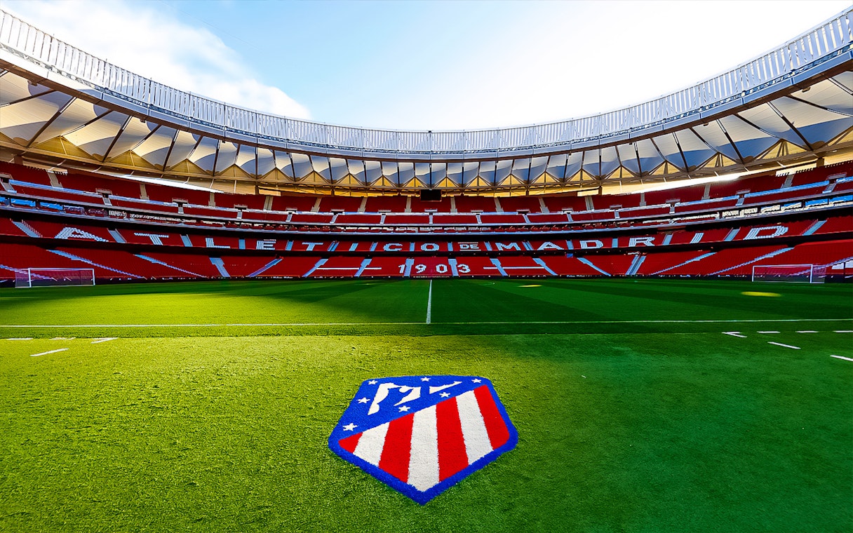 Cívitas Metropolitano Stadium field with Atlético de Madrid logo, Madrid, Spain.