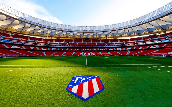Cívitas Metropolitano Stadium field with Atlético de Madrid logo, Madrid, Spain.