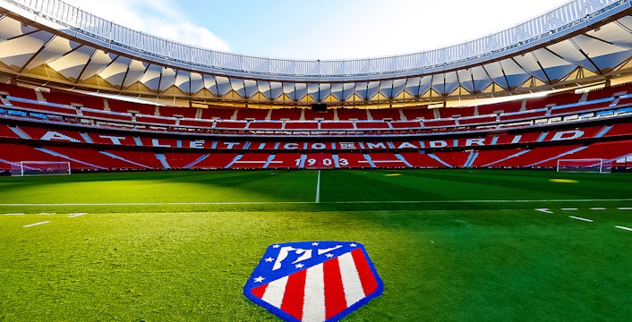 Cívitas Metropolitano Stadium field with Atlético de Madrid logo, Madrid, Spain.