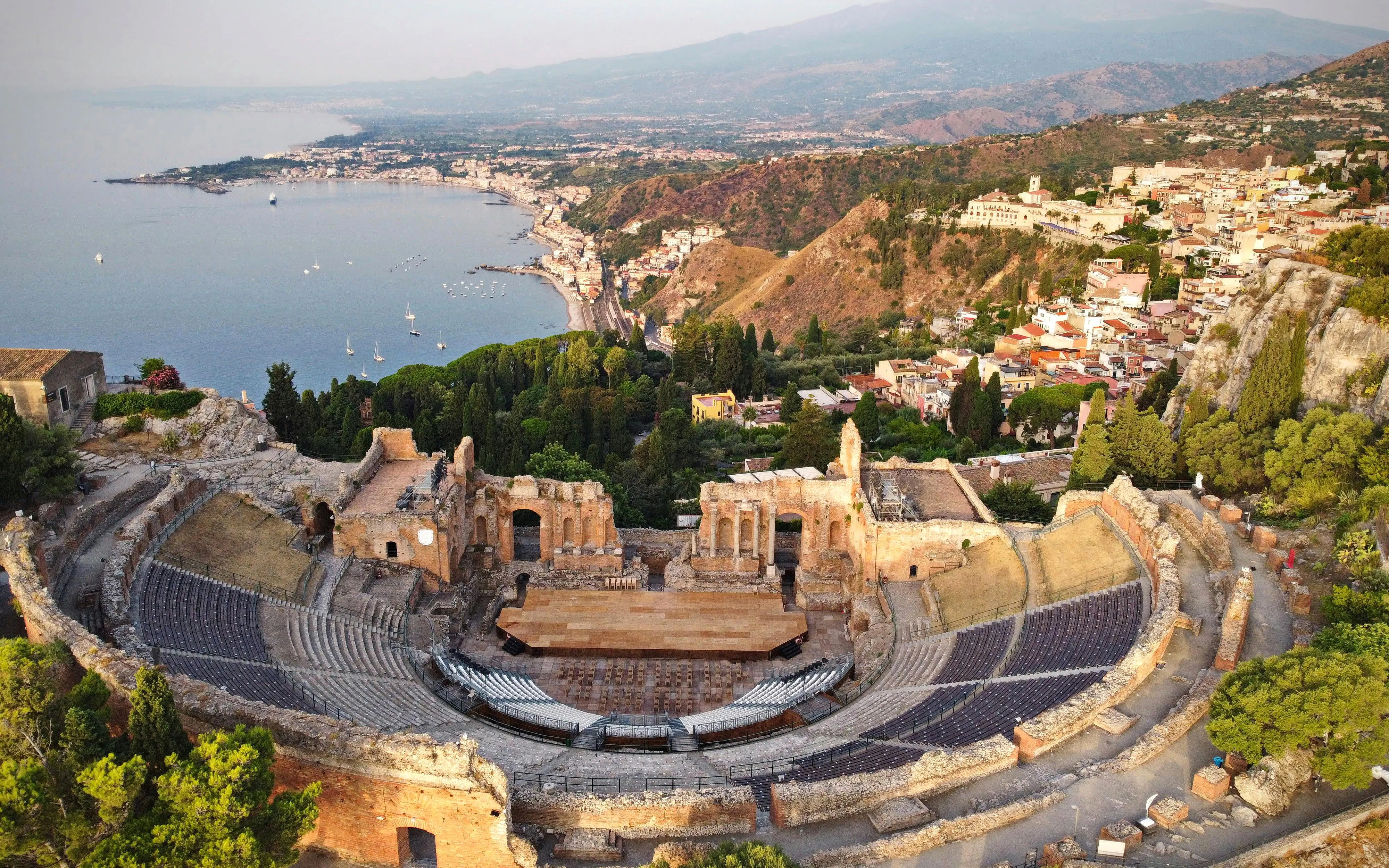 Ancient Greek theatre overlooking the coastline in Taormina, Sicily, Italy.