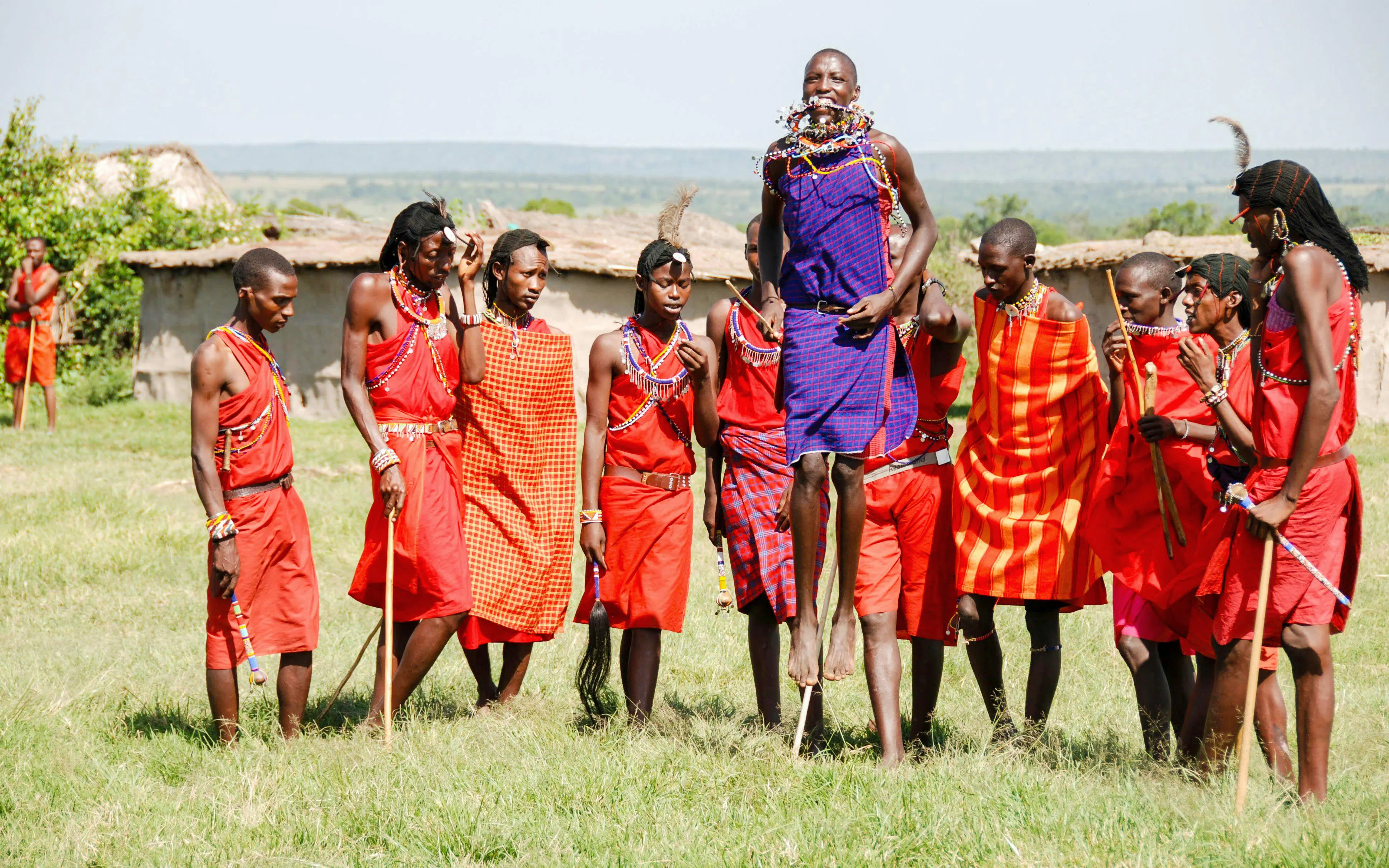 A group of Maasai men performing a traditional jumping dance in Kenya.