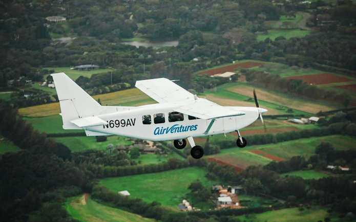 Small plane flying over lush landscapes on a private Kauai air tour.