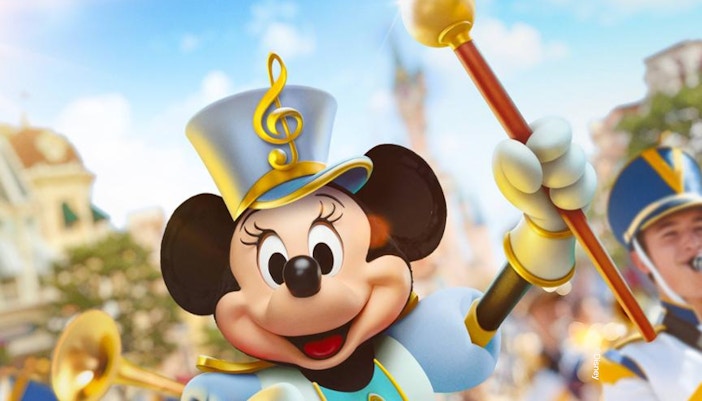 Mickey Mouse in a marching band uniform at Disneyland Paris parade.