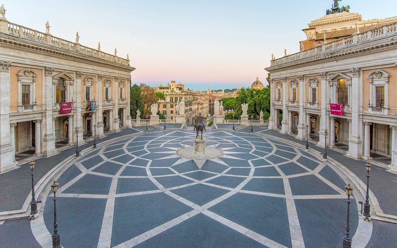 Piazza del Campidoglio square with tourists near Musei Capitolini entrance in Rome.
