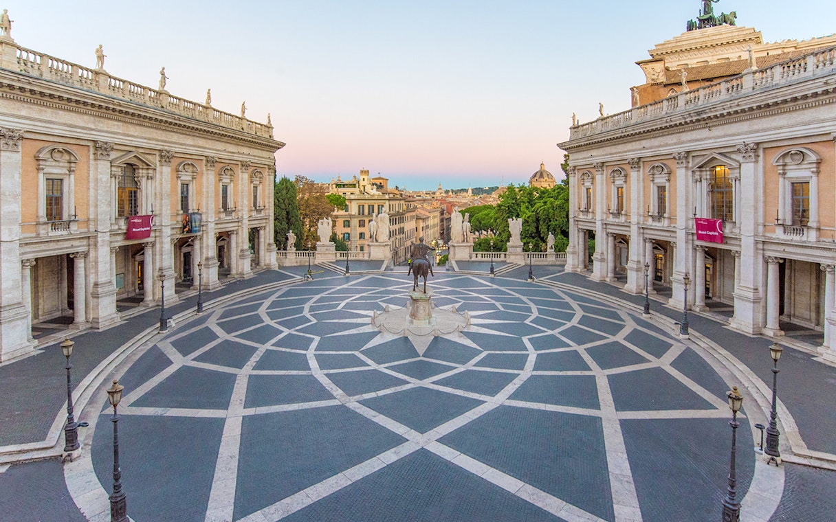 Piazza del Campidoglio in Rome with geometric paving and surrounding historic buildings.