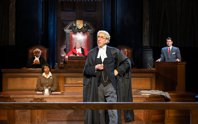 Courtroom scene from "Witness for the Prosecution" performance with actors in legal attire.