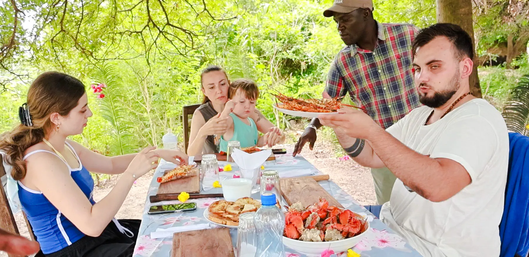 Lunch gathering with seafood on Funzi Island excursion, Diani Beach.