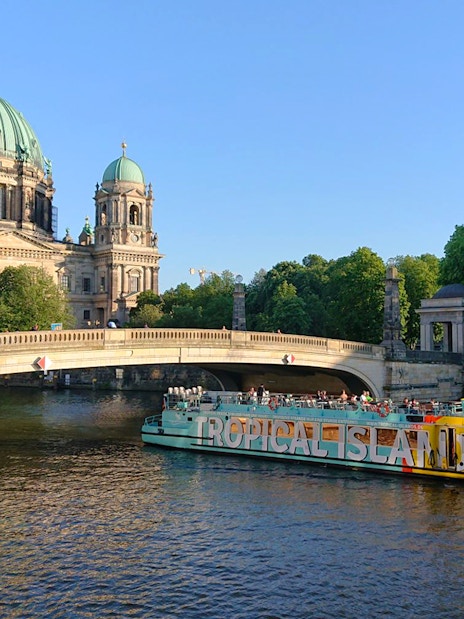 Sightseeing cruise boat near Berlin Cathedral on the Spree River, East-Side-Tour.