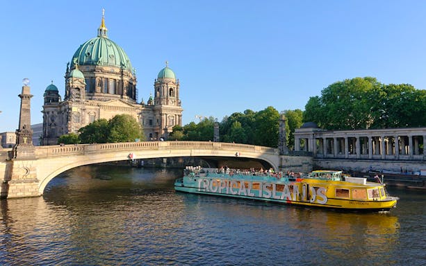 Sightseeing cruise boat near Berlin Cathedral on the Spree River, East-Side-Tour.