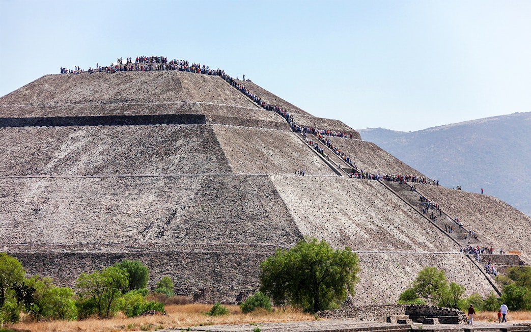 People climbing the Pyramid of the Sun in Teotihuacan, Mexico.