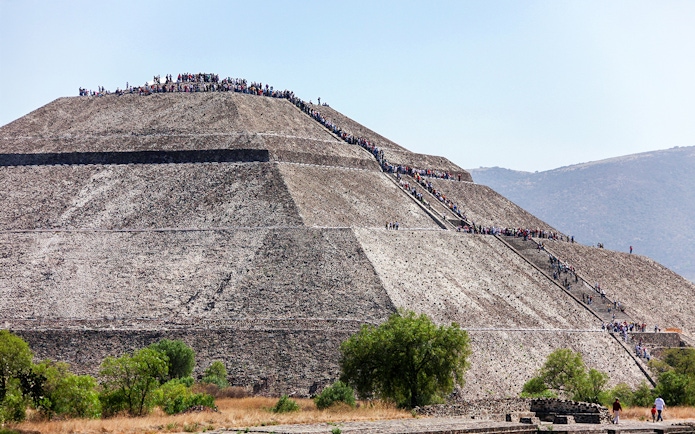 People climbing the Pyramid of the Sun in Teotihuacan, Mexico.