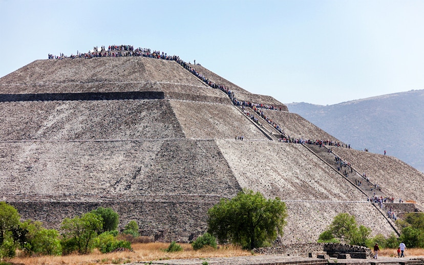 People climbing the Pyramid of the Sun in Teotihuacan, Mexico.