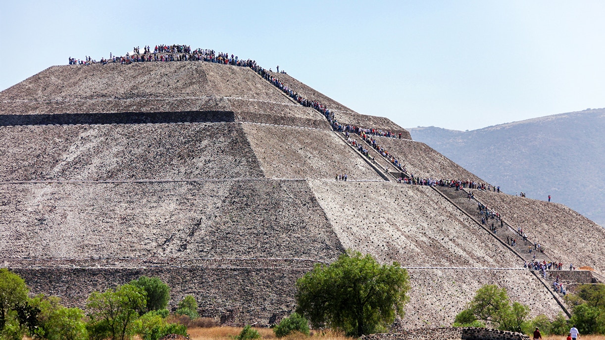 Visitors ascending the Pyramid of the Sun at Teotihuacan, Mexico.
