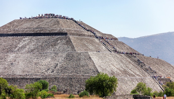 People climbing the Pyramid of the Sun in Teotihuacan, Mexico.