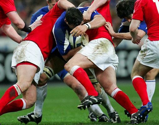 Rugby players in a scrum during a match.