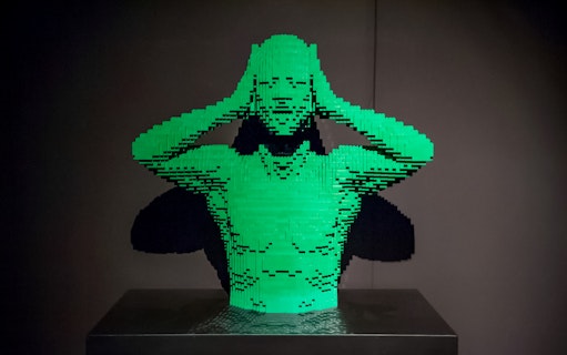 Lego sculpture of a person holding their head, featured in Australia: The Art of the Brick.