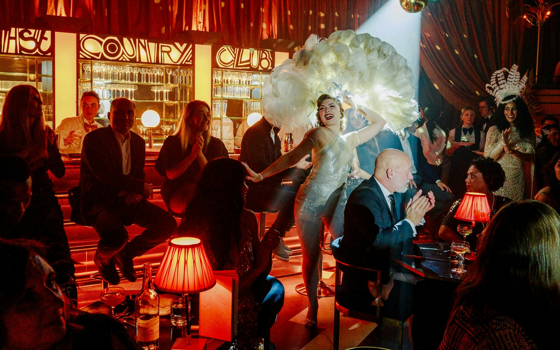 Cabaret performance at 58th Street club with dancers and audience.