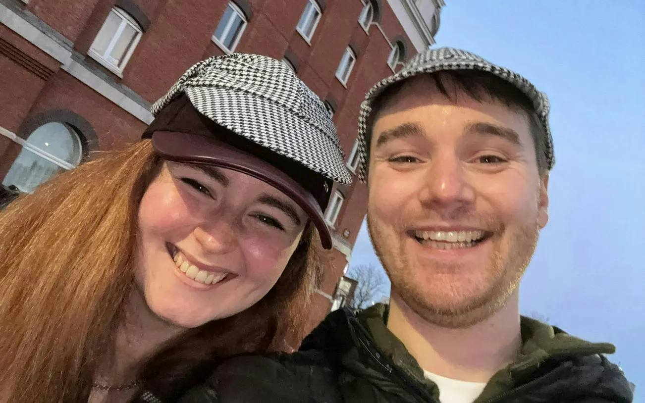 Participants in detective hats enjoying Belfast Secret Society Detective Mystery game.