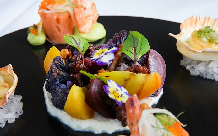 Entree platter with seafood and vegetables on Glass Boat Dinner Cruise, Sydney.