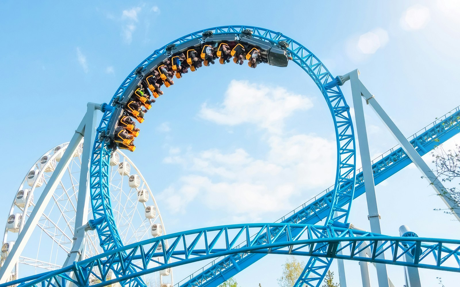 Father and son on Flying dinosaur ride