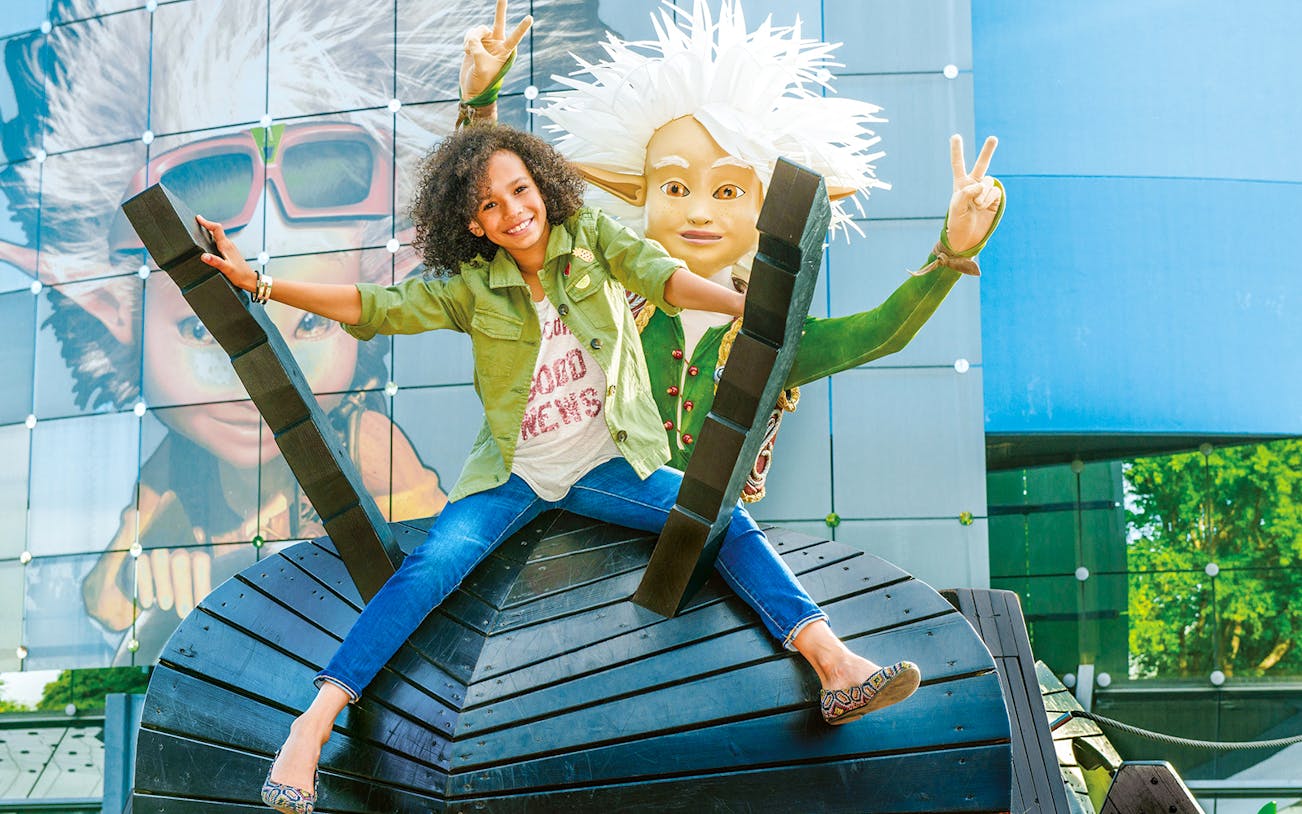 Kid enjoying a ride at Futuroscope theme park in France.