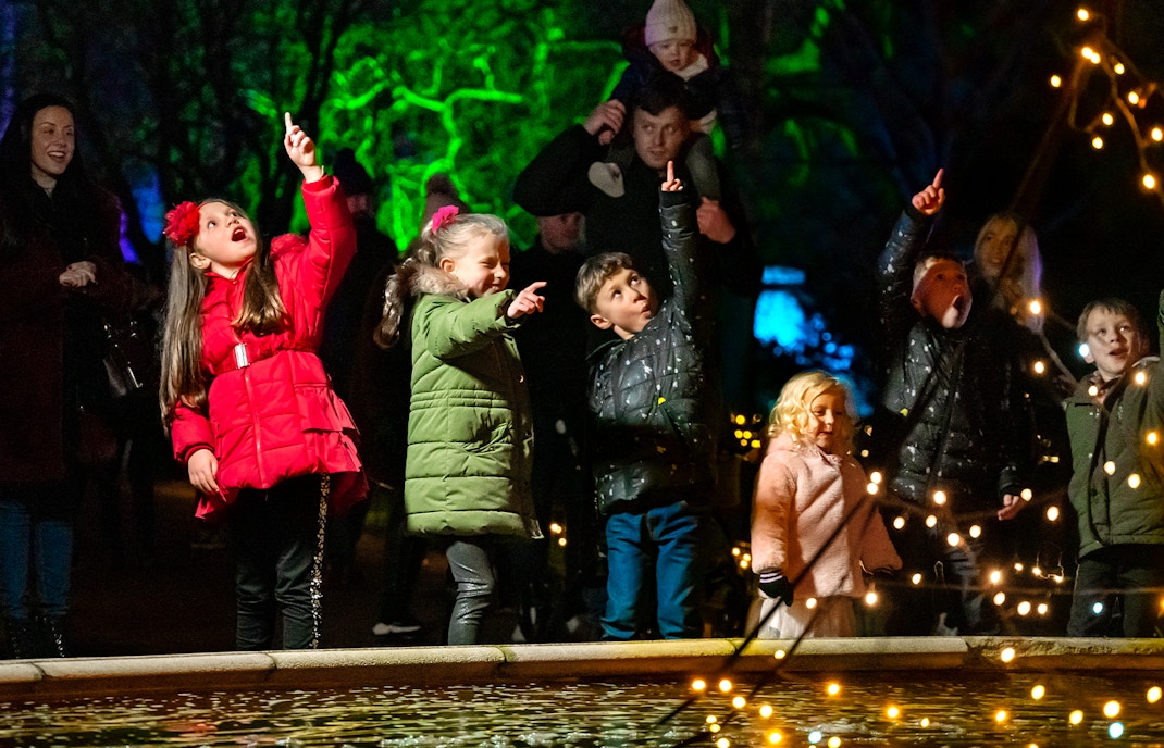 Children pointing at lights during Warwick Castle Light Trail.