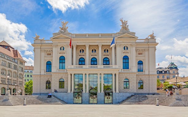 Zurich Opera House facade on a sunny day during city sightseeing tour.